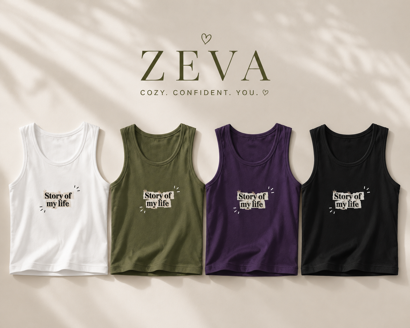 Four sleeveless tank tops in white, olive green, purple, and black are lined up against a warm beige background with soft leaf shadows. Each tank top has the text 'Story of my life' printed on the chest.